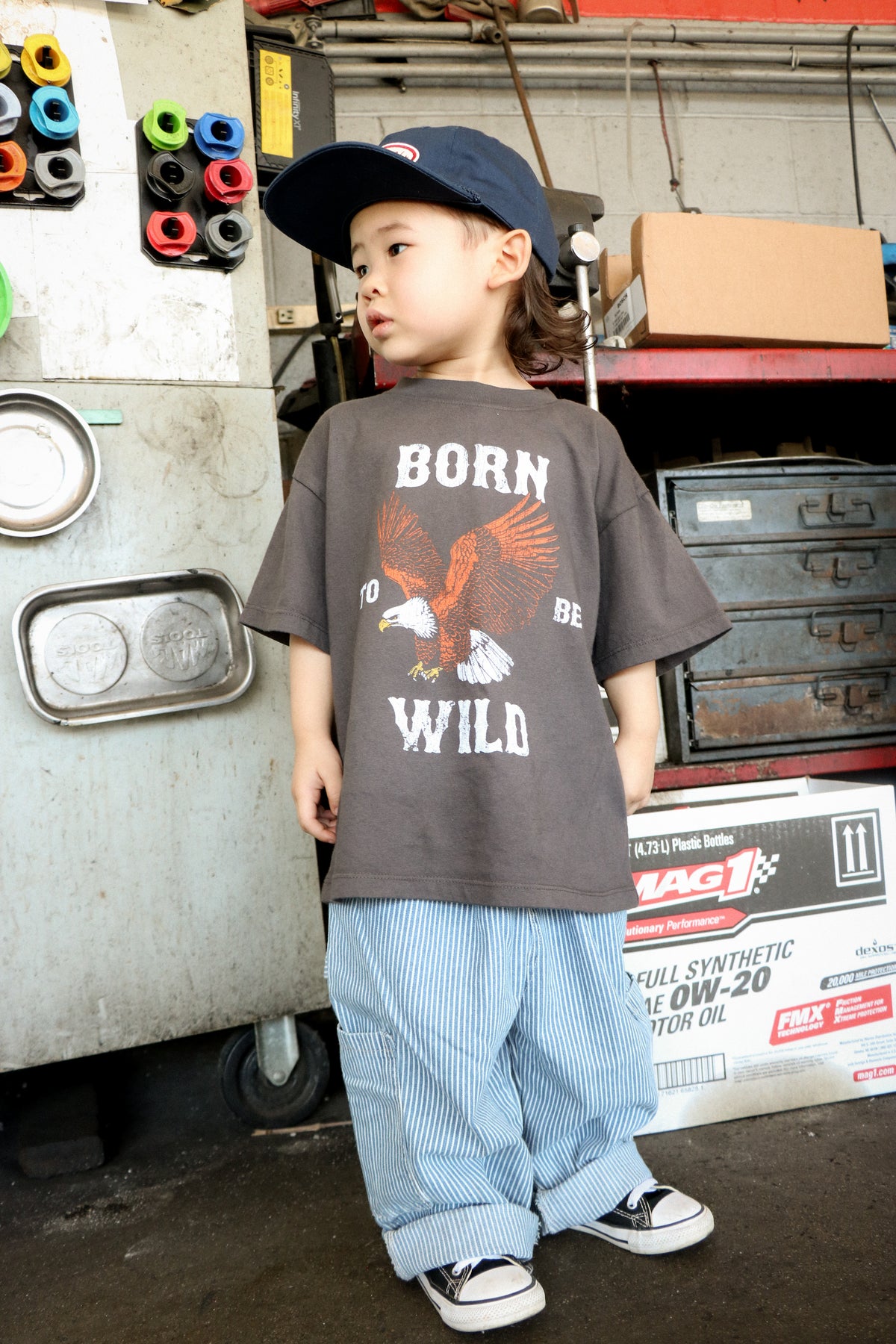 Child wearing black Born to Be Wild eagle T-shirt