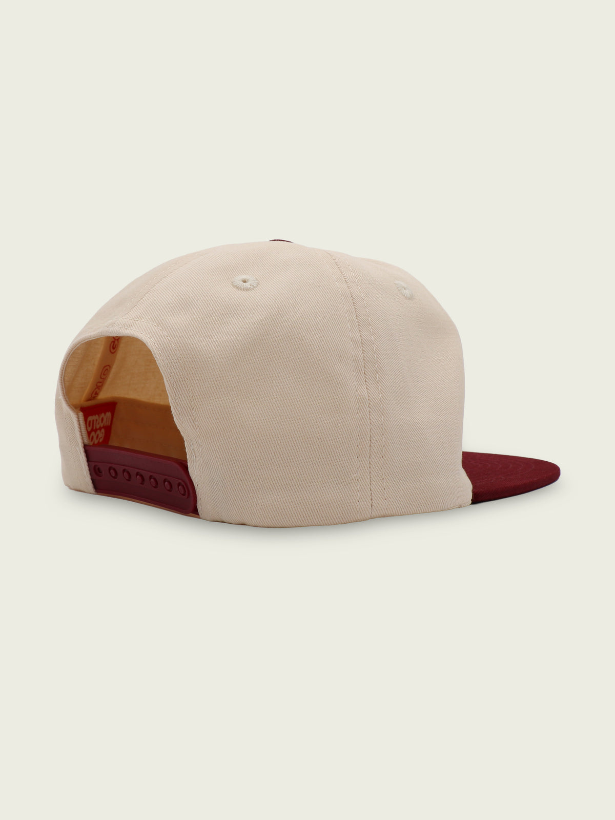 Back of wine and cream two-tone cotton snapback hat