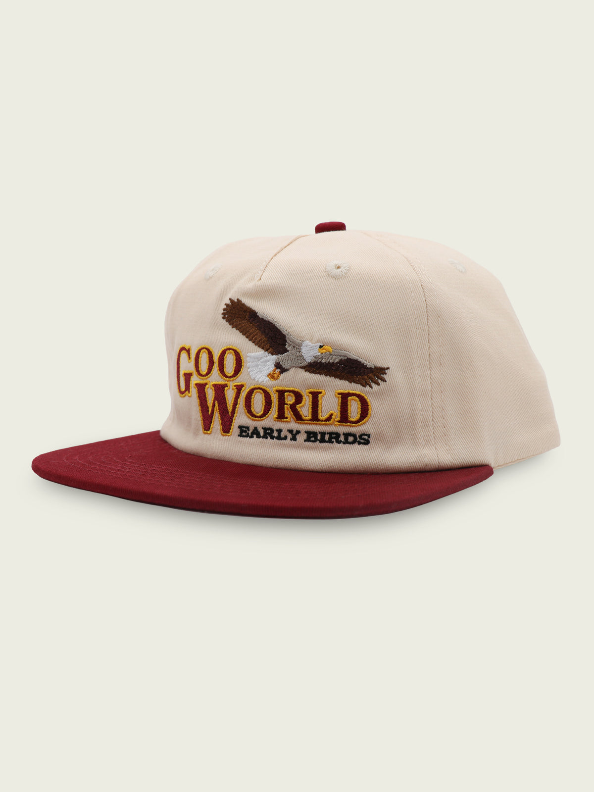 Burgundy and cream 100% cotton five-panel snapback with embroidered eagle graphic