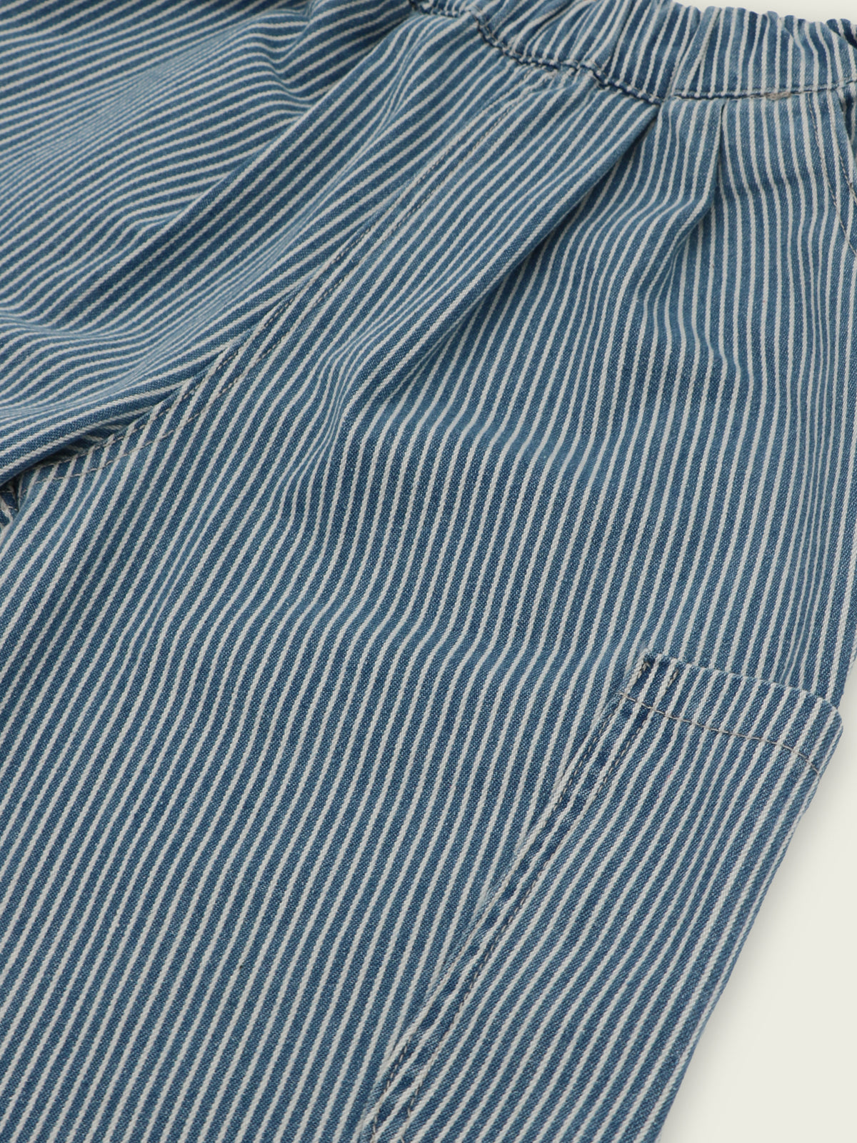Patch pocket and elastic waistband detail on hickory stripe jeans